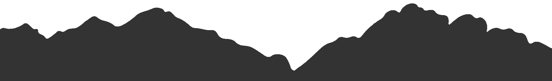 Silhouette of a mountain range against a solid green background.